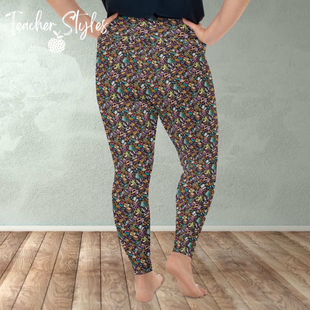 Classroom Doodle plus size leggings by Teacher Styles. Model is shown from the waist down. Leggings are covered in doodle pattern of classroom objects - chalkboards, microscopes, scissors, art palettes etc. Highlight colors of purple and teal. back  view