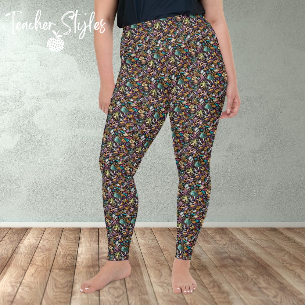 Classroom Doodle plus size leggings by Teacher Styles. Model is shown from the waist down. Leggings are covered in doodle pattern of classroom objects - chalkboards, microscopes, scissors, art palettes etc. Highlight colors of purple and teal.  front view