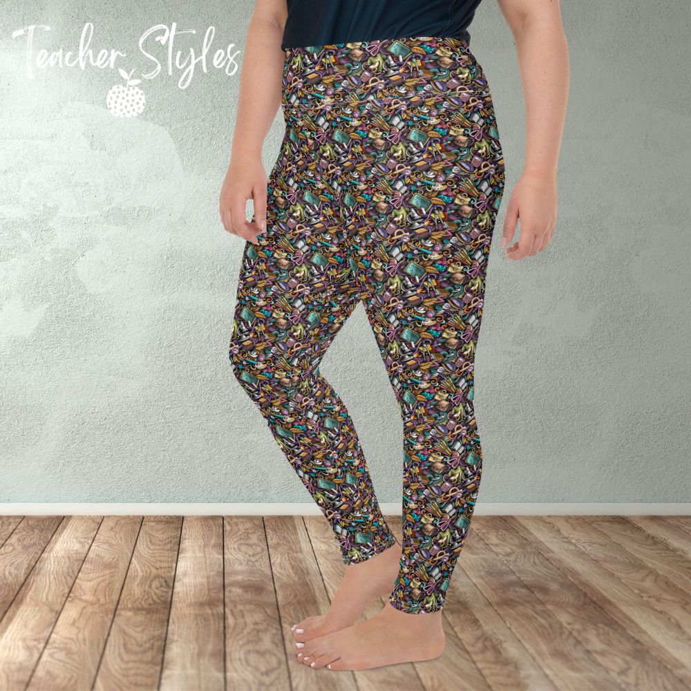 Classroom Doodle plus size leggings by Teacher Styles. Model is shown from the waist down. Leggings are covered in doodle pattern of classroom objects - chalkboards, microscopes, scissors, art palettes etc. Highlight colors of purple and teal.  side view