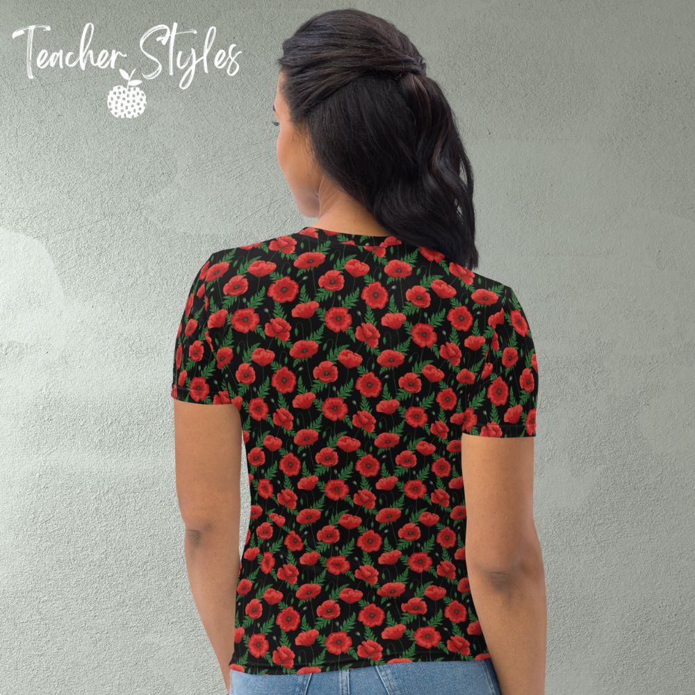 Poppies - black T-shirt by Teacher Styles. Model shown from the waist up.  T-shirt has black background with pattern of red poppies and greenery. Beautiful floral top perfect for Remembrance Day, Armistice Day and National Poppy Day. Back  view.