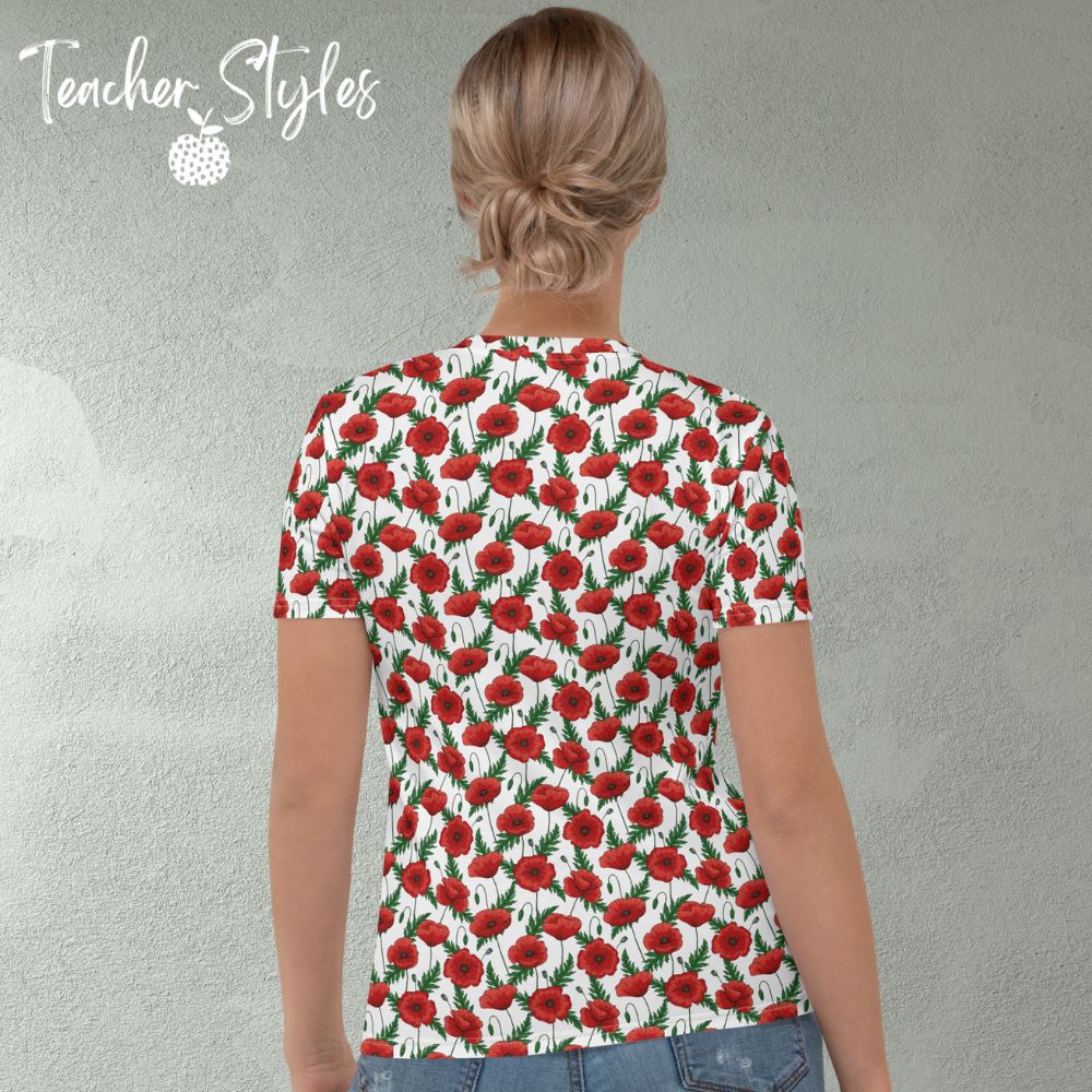 Poppies T-shirt - white by Teacher Styles. Model shown from the waist up.  T-shirt has white background with pattern of red poppies and greenery. Beautiful floral top perfect for Remembrance Day, Armistice Day and National Poppy  Day. Back view