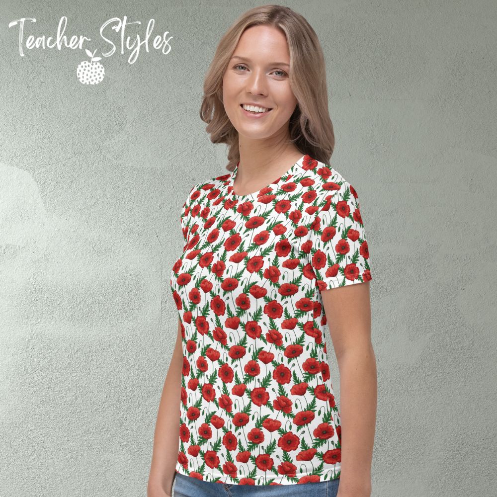 Poppies T-shirt - white by Teacher Styles. Model shown from the waist up.  T-shirt has white background with pattern of red poppies and greenery. Beautiful floral top perfect for Remembrance Day, Armistice Day and National Poppy  Day. Side view