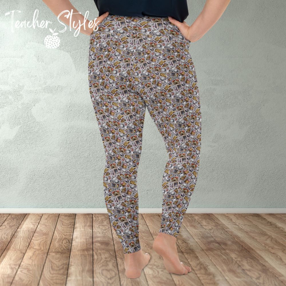 School Essentials plus size leggings - gray by Teacher Styles. Model is shown from the waist down. Leggings feature light gray background and a doodle pattern of classroom objects - chalkboards, pencils, calculators, globes etc. back view