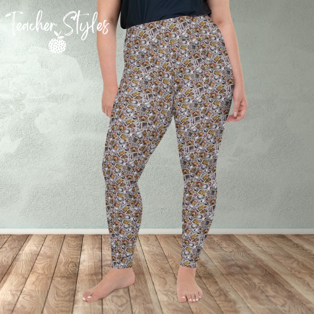 School Essentials plus size leggings - gray by Teacher Styles. Model is shown from the waist down. Leggings feature light gray background and a doodle pattern of classroom objects - chalkboards, pencils, calculators, globes etc.   front view