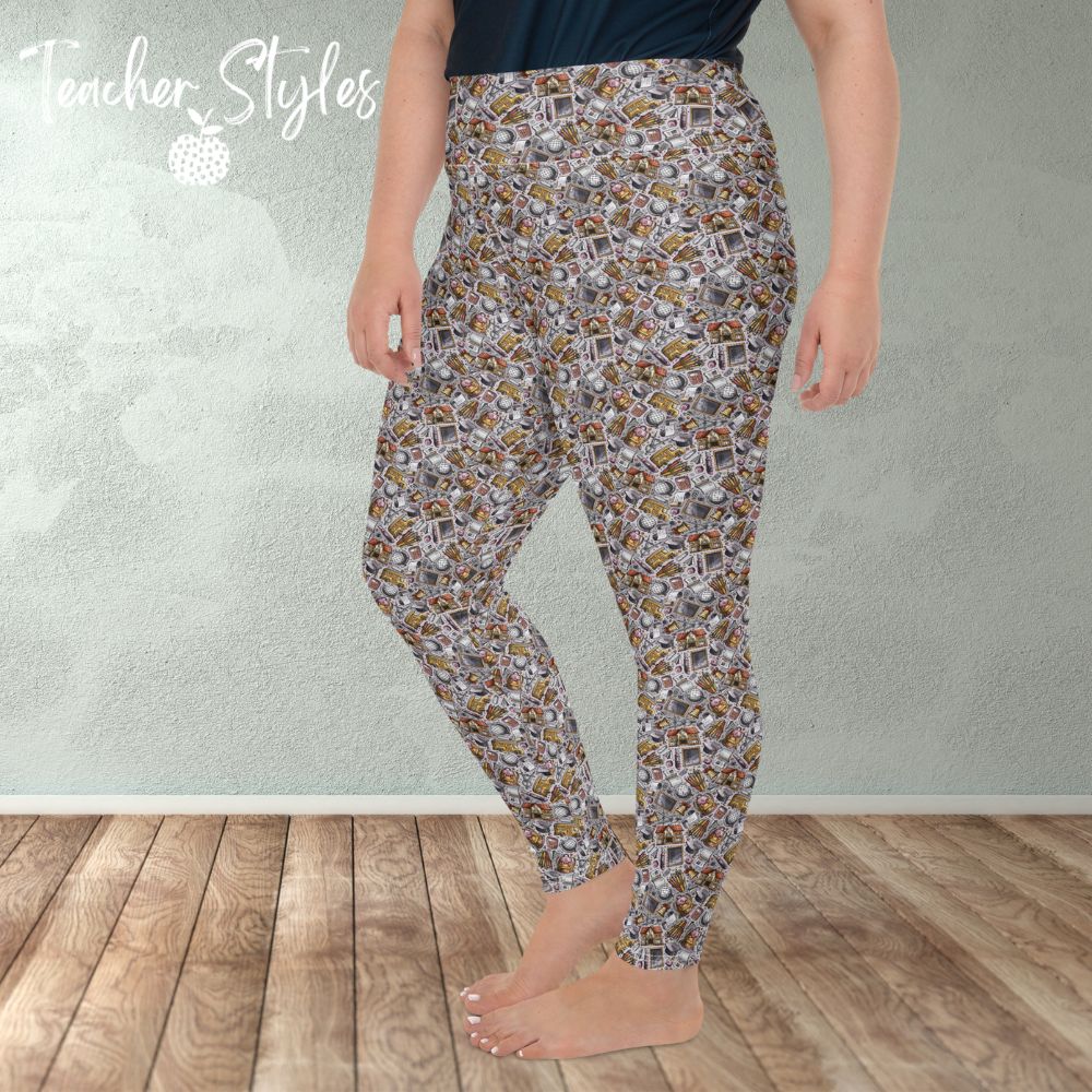 School Essentials plus size leggings - gray by Teacher Styles. Model is shown from the waist down. Leggings feature light gray background and a doodle pattern of classroom objects - chalkboards, pencils, calculators, globes etc. side view