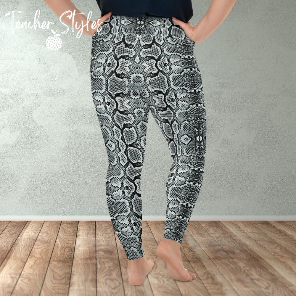 Snake Print leggings by Teacher Styles. Model is shown from the waist down. Leggings are covered in snake skin pattern in various tones of grey. Back view.