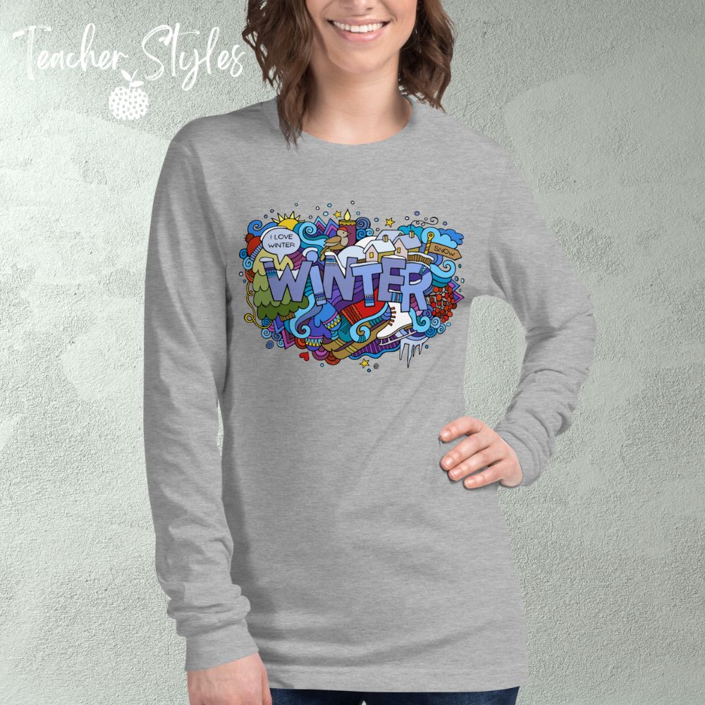 Winter Long sleeve T-shirt by Teacher Styles. Model is shown from the waist up. Grey heather tshirt with the word Winter in block letters surrounded by winter doodle of snow and skates and more!